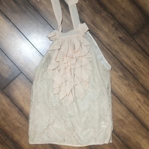 Fun comfortable dress top with neck tie in back.